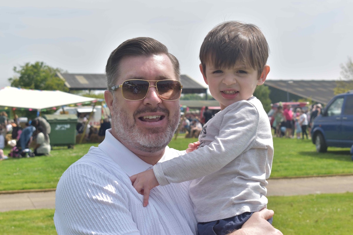 Principal and CEO of Suffolk New College and Suffolk Rural Alan Pease with his two year old grandson called Oscar at the 2024 Big Day Out event